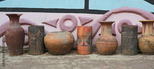 Old style clay jar in the garden. Garden decoration.