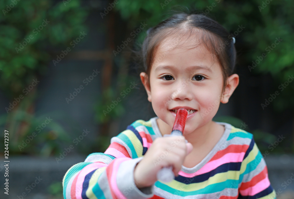Close-up kid girl feeding with liquid medicine.
Close-up kid girl feeding with liquid medicine.
