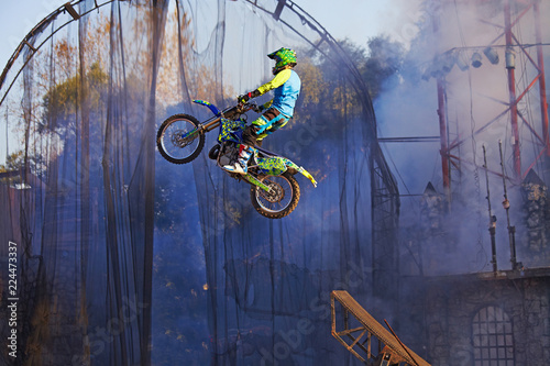 Wallpaper Mural Pro motocross rider riding fmx motorbike, jumping performing extreme stunt. Professional biker jumps Torontodigital.ca