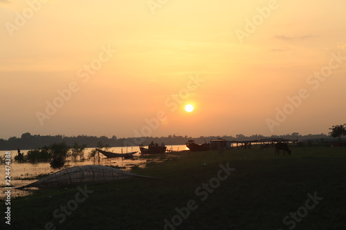 village sunset seen on river