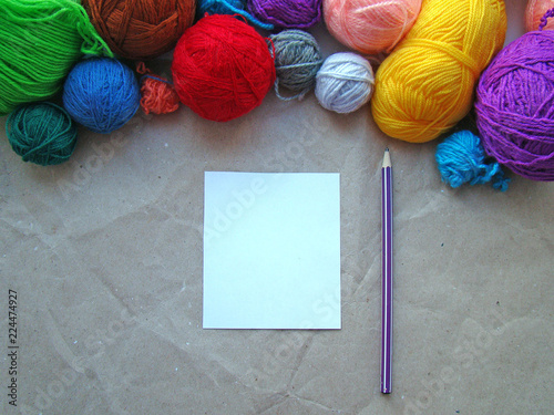 Wallpaper Mural A sheet of paper, a pencil and a knitting yarn Torontodigital.ca