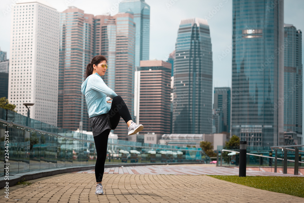 Urban woman doing workout in the city Urban woman doing workout in the city