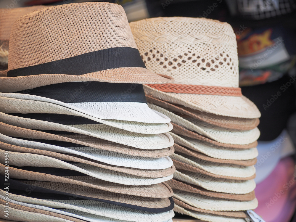 Group of pretty hats for men and ladies sale on shopping street.