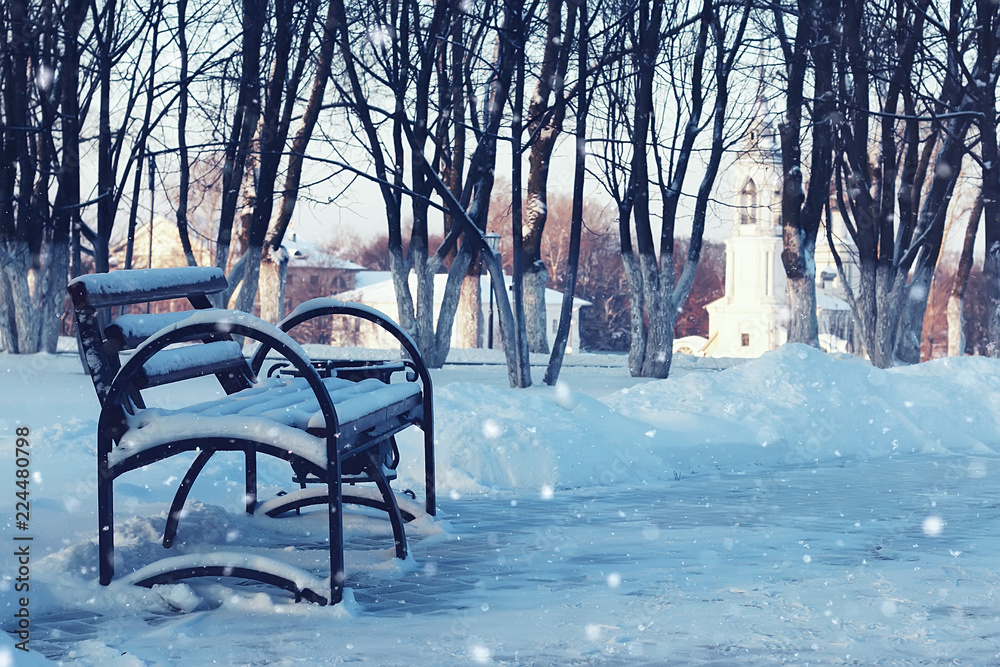 Winter street bench in city