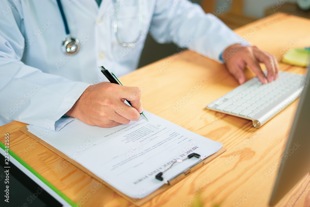 Man Doctors and patient are discussing something ,Having Consultation,Medical Pretty Doctor working in hospital writing a prescription, Healthcare and medically concept,selective focus Man Doctors and patient are discussing something ,Having Consultation,Medical Pretty Doctor working in hospital writing a prescription, Healthcare and medically concept,selective focus