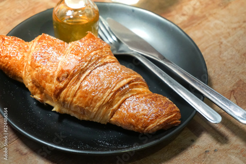 croissants with honey on plate close yummy
