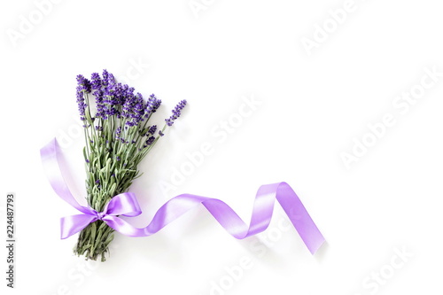 Lavender. Bunch fresh of lavender on white table background. Violet flowers. Greeting floral card with place for text. 