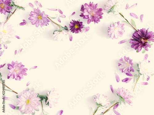 Flowers composition. Frame made of fall flowers on light pastel yellow background. Autumn concept. Flat lay, top view, copy space 