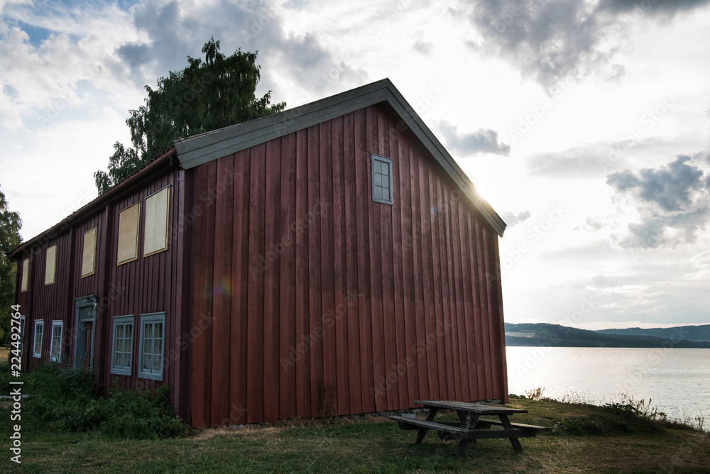 scenic view of red building near lake, Hamar, Hedmark, Norway