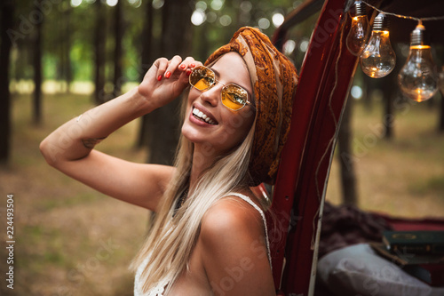 Canvas Print Photo of pretty hippy woman, wearing stylish accessories smiling while resting i