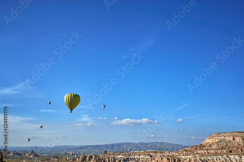 Beautiful rocky landscape with balloons in the mountains on a sunny summer day.