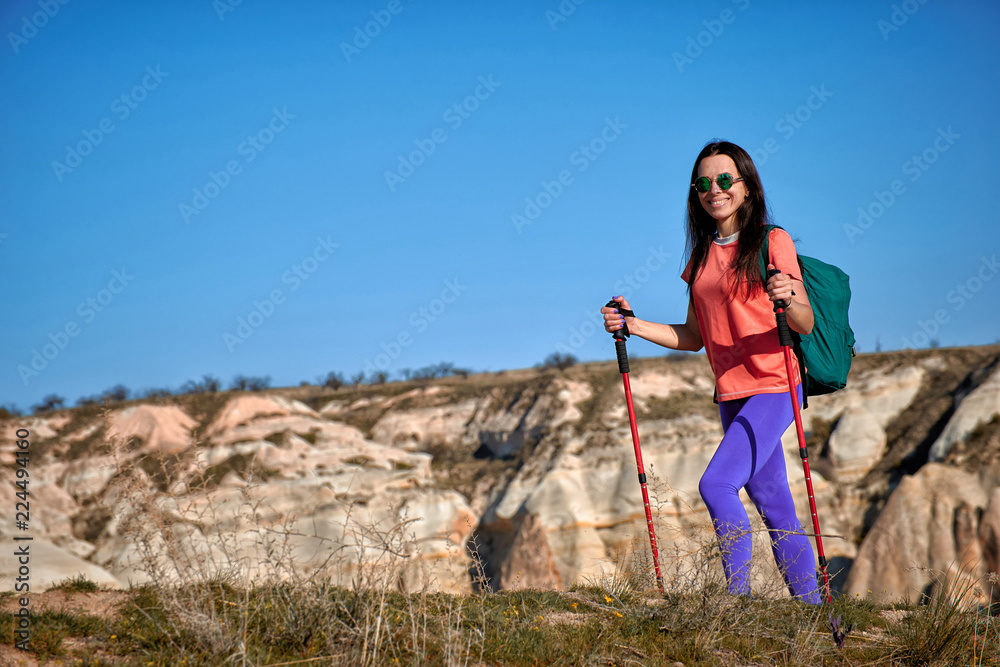Naklejka premium Summer hike in the mountains with a backpack and tent.