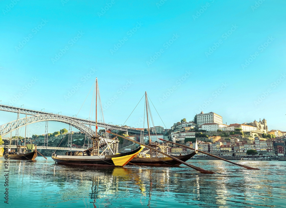 Historical boats in Porto Portugal on the river. Beautiful view of the city