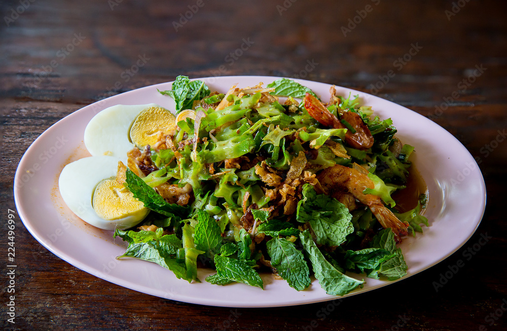 Wing bean spicy and sour salad, side dish boiled egg, thai traditional food  Yum Tua Poo, thai seafood cuisine, image for menu list,background,wallpaper and copy space