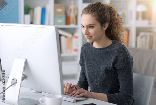 Young woman using a computer in the office