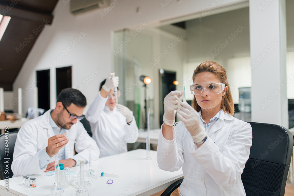 Working in the laboratory. Working in the laboratory.