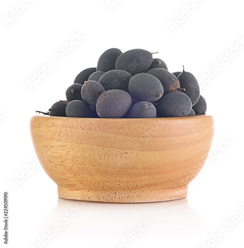 velvet tamarind fruit ( Dialium cochinchinense) isolated on white. photo