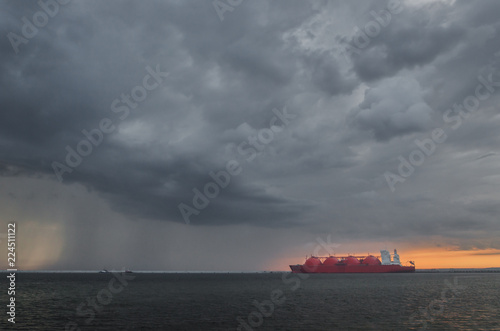 LNG TANKER - Rain and stormy dramatic clouds over a gas terminal in Swinoujscie 