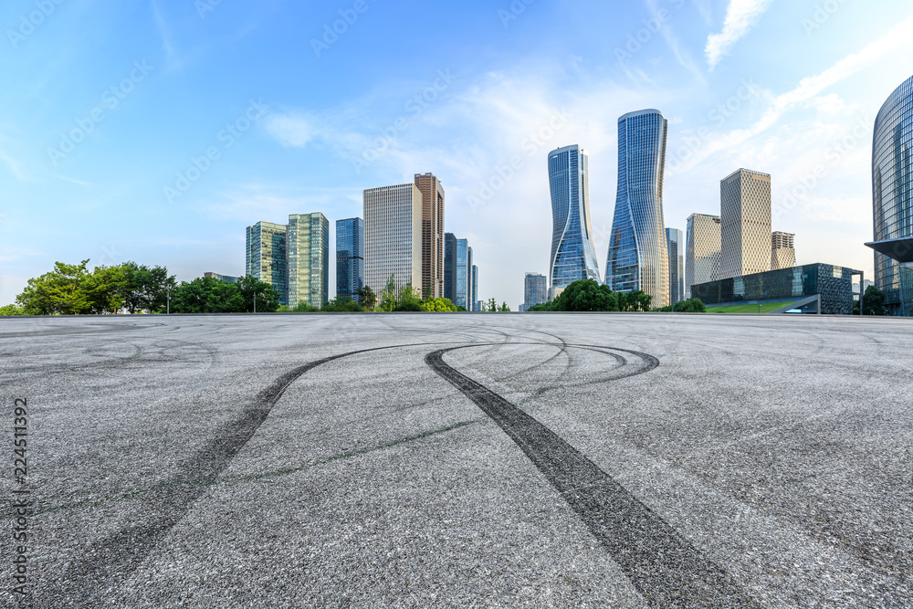 Empty asphalt square and modern buildings in Hangzhou