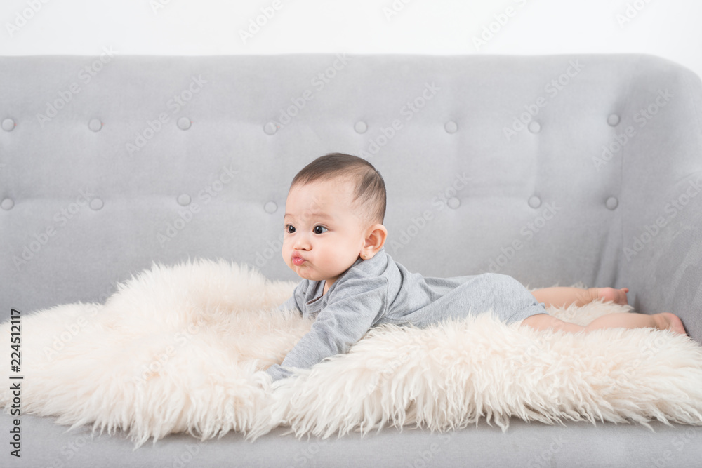 cute happy baby portrait lying on fur cute happy baby portrait lying on fur