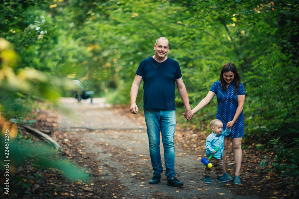 happy family with son on background forest. happy family with son on background forest.