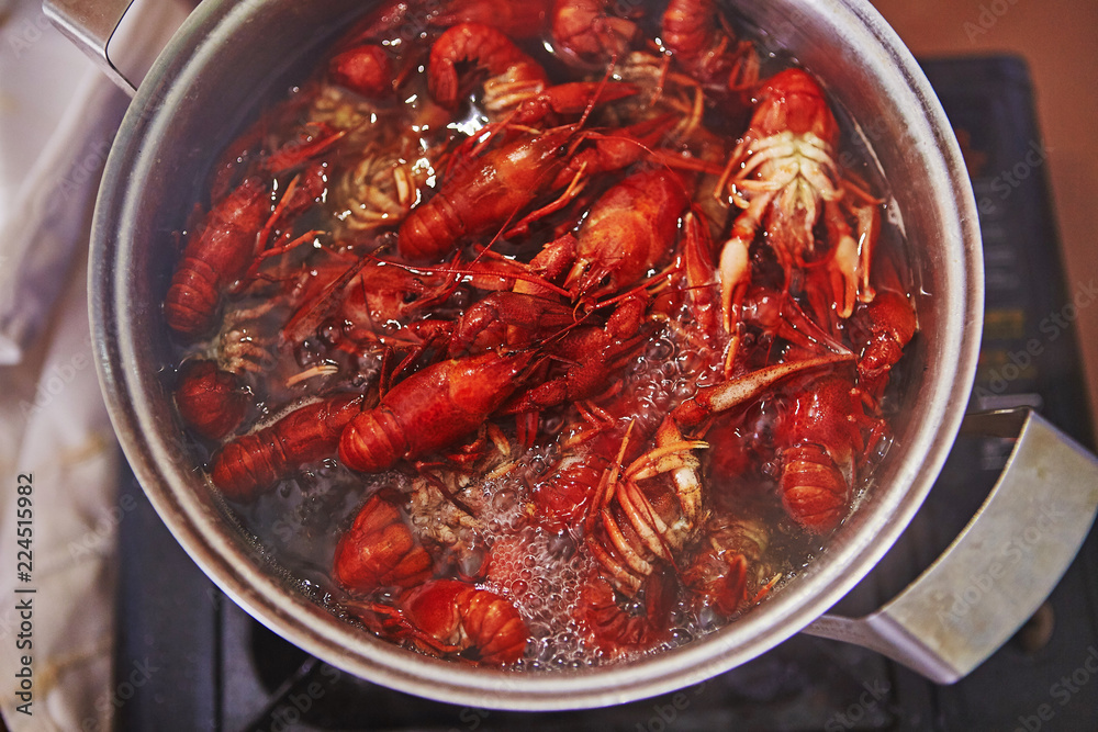 Crawfish cooking boiling in pot with spices Crawfish cooking boiling in pot with spices