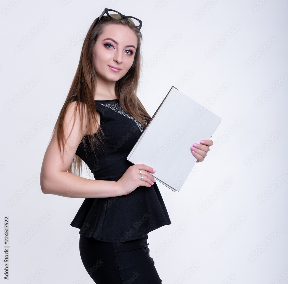 girl in glasses in a black dress with folders on a white background, office worker girl in glasses in a black dress with folders on a white background, office worker