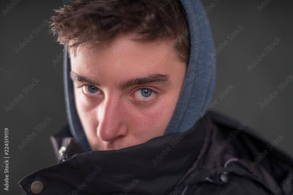portrait of a young man with hoodie portrait of a young man with hoodie