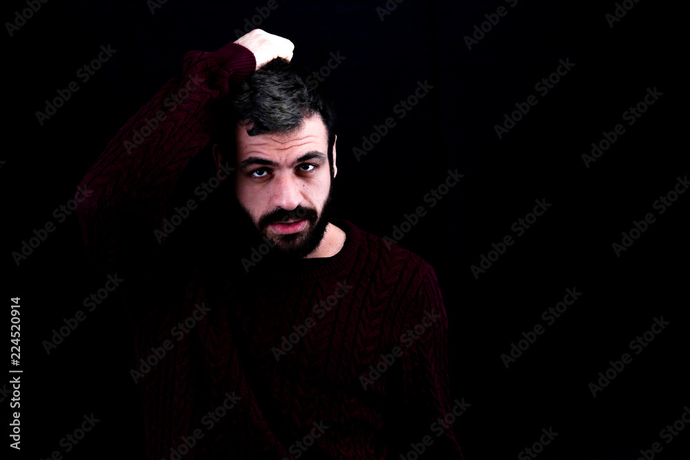 portrait of man in front of black background portrait of man in front of black background