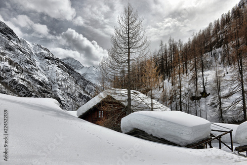 Roof of a chalet cowred with snow. photo