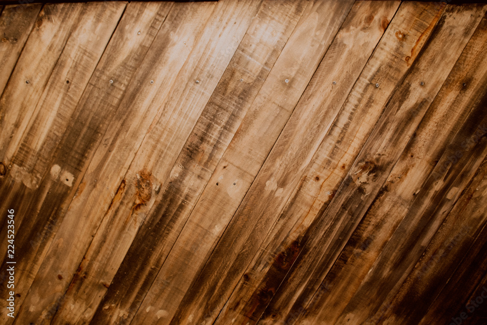 Obraz premium Old wood reclaimed plank texture background. Diagonal flat boards with beautiful natural pattern. Old grunge dark textured wall. Close up of wall made of wooden planks