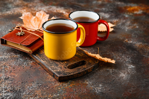 Enameled cup of hot tea photo