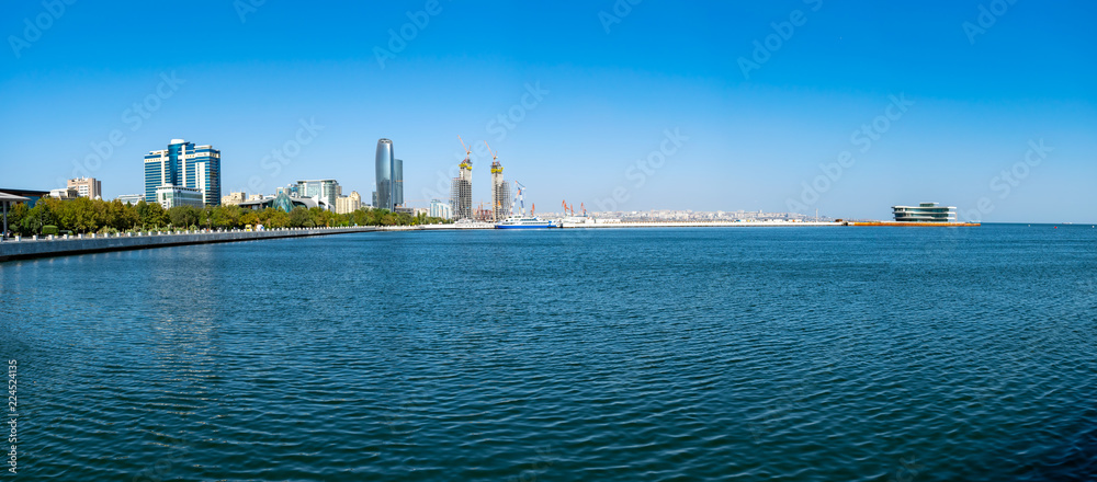 Naklejka premium Baku, Azerbaijan - September 26, 2018. Panoramic view of skyline in Baku, Azerbaijan, with historic and modern architecture. Blue Caspian Sea Panorama