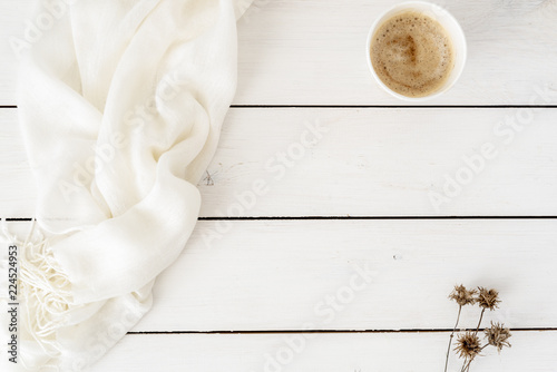 Styled stock photography white office desk table with flowers and coffee cup. Top view with copy space. Flat lay. Top view. Copy space for lettering, text, blogs, magazines, headers