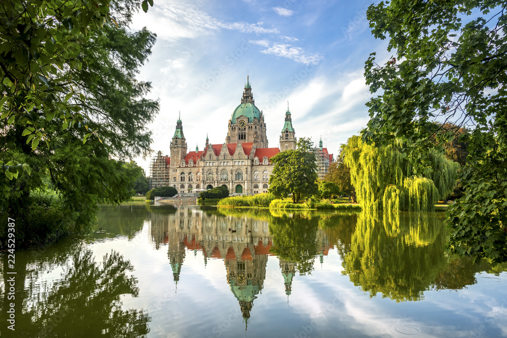 View of New Town Hall reflected in pond, Hanover, Germany View of New Town Hall reflected in pond, Hanover, Germany