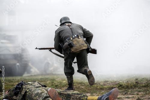 Historical reenactment of soldiers during the Second World War, view from the back photo