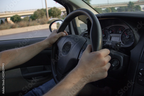 Car driver hand position © ozencdeniz