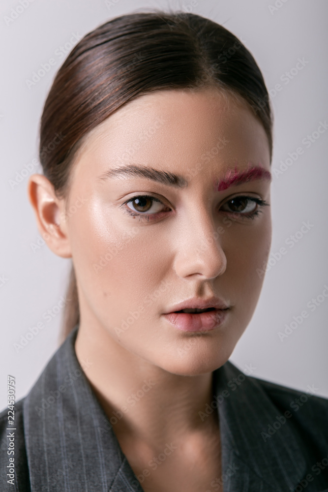 Beautiful emotional girl with creative and bright make-up on a white background