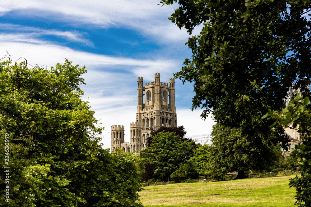 The beautiful Ely Cathedral, often know as 'the Ship of the Fens' because of its prominent position above the surrounding flat landscape towers over the streets of the picturesque city of Ely.