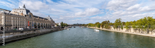 Panoramic view from Pont Royal with view over Seine river, Musee d'Orsay and Grand Palais - Paris, France