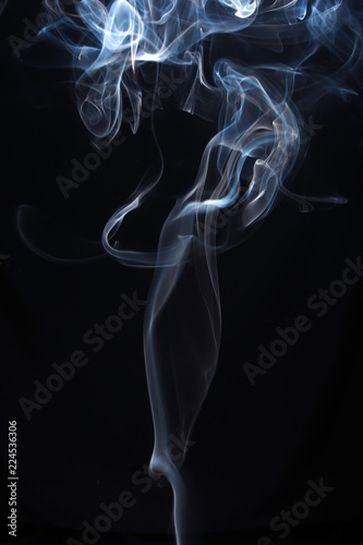 Fototapeta Naklejka Na Ścianę i Meble -  Blue and white smoke on black background
