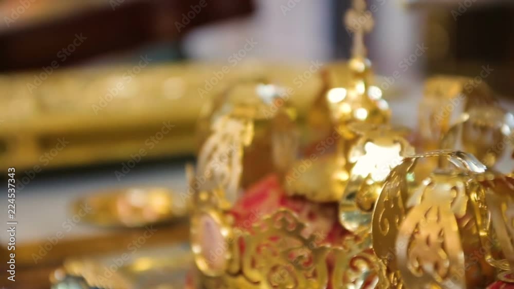 Wedding rings of newlyweds during the consecration of holy water in the church Wedding rings of newlyweds during the consecration of holy water in the church