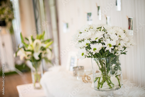 Beautiful bouguet of white chamomiles flowers in water can, watering pot, concept vintage style © kanpisut