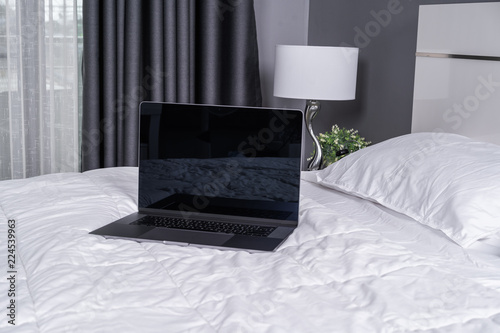 Wallpaper Mural laptop computer on a bed Torontodigital.ca