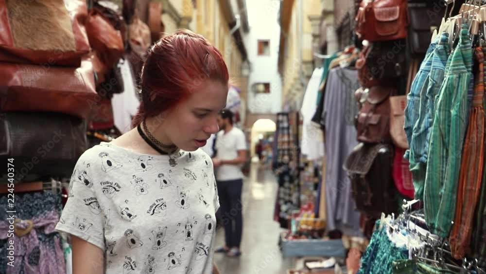 redhead young girl walking through a arabic market redhead young girl walking through a arabic market