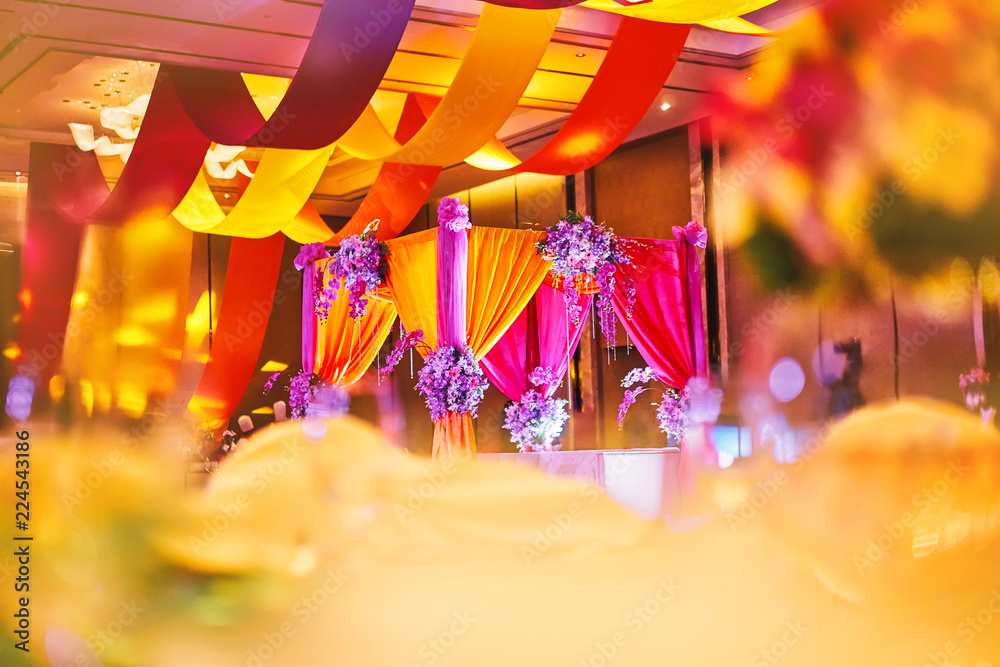 Colorful stage decoration for bride and groom in sangeet night of indian  wedding Stock Photo | Adobe Stock