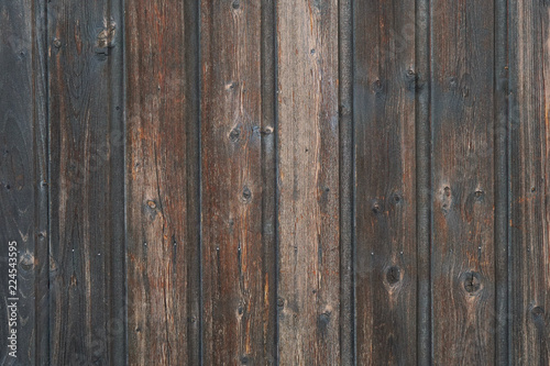 old weathered distressed dark brown wooden boarding wood texture background