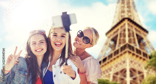 Photography summer vacation, holidays, travel, technology and people concept- group of smili