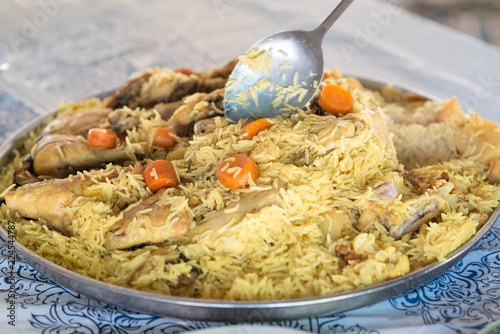 Maqluba traditional Arab food.The dish includes meat, rice, and photo