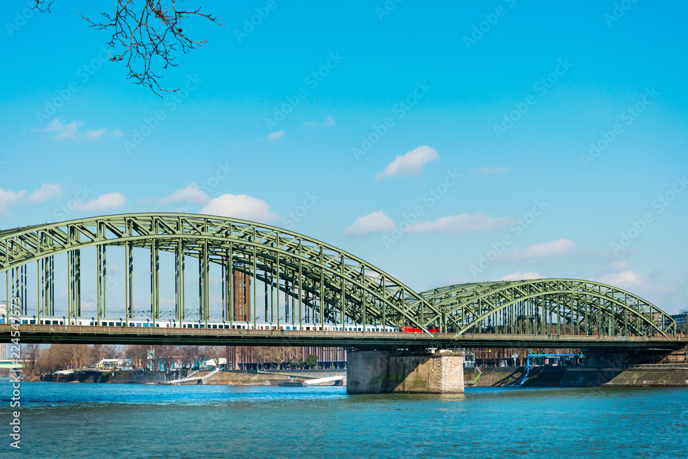 Naklejka premium COLOGNE, GERMANY- March 14, 2018 : Hohenzollern Bridge, is a bridge crossing the river Rhine in the German city of Cologne